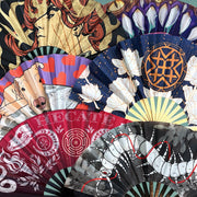 Custom fabric clack fans with colorful full-print designs displayed in a fan arrangement